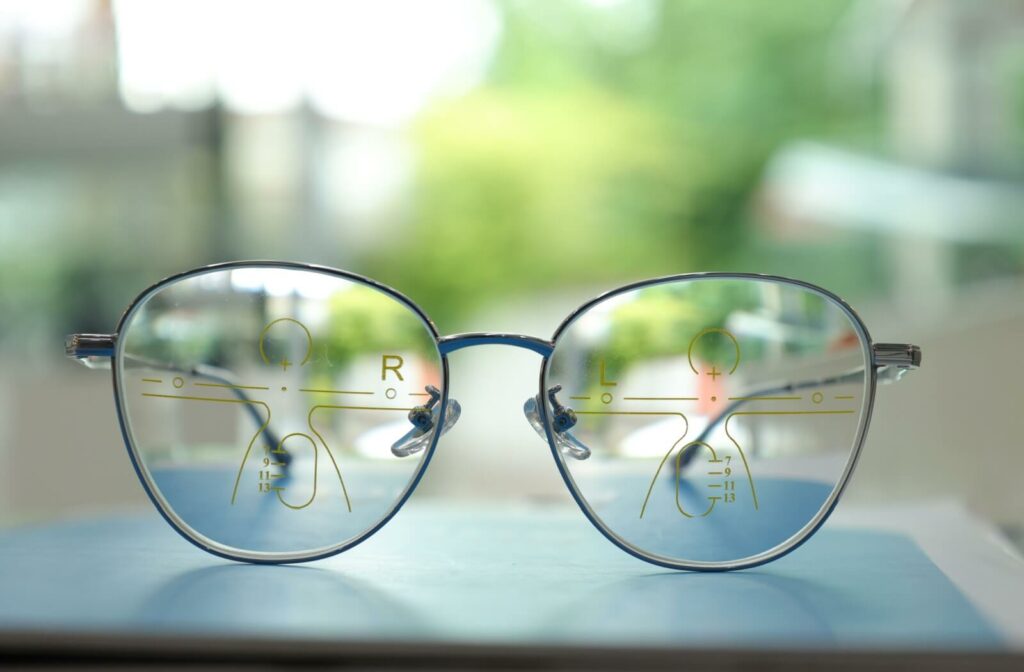 A close-up image of eyeglasses showing the details of how the views in their progressive lenses work.